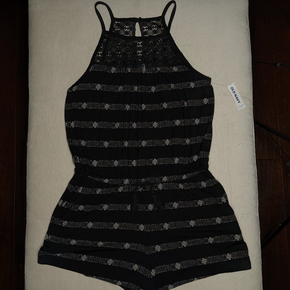 Black and white patterned romper with crochet detail yoke
